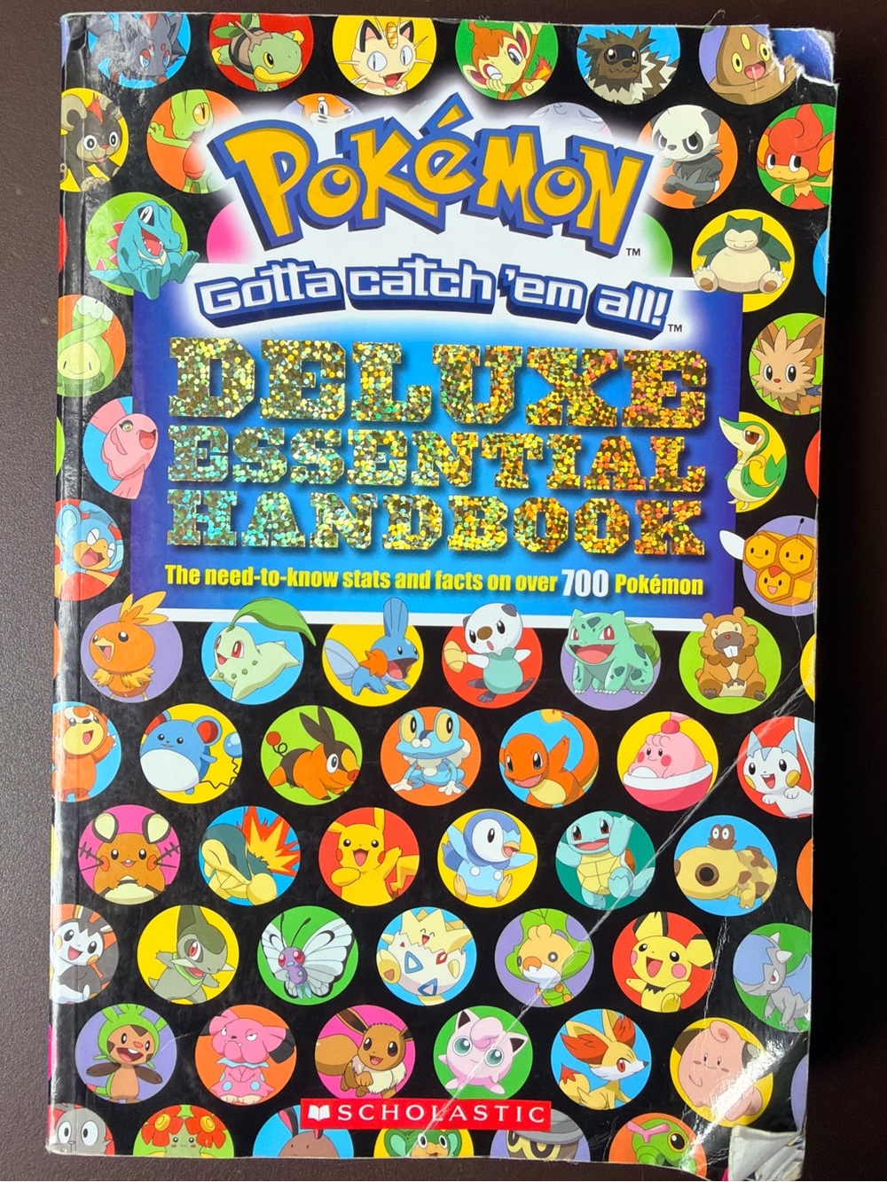 Pokemon Deluxe Essential Handbook - Black, Blue, Yellow, Red, Green, Orange
